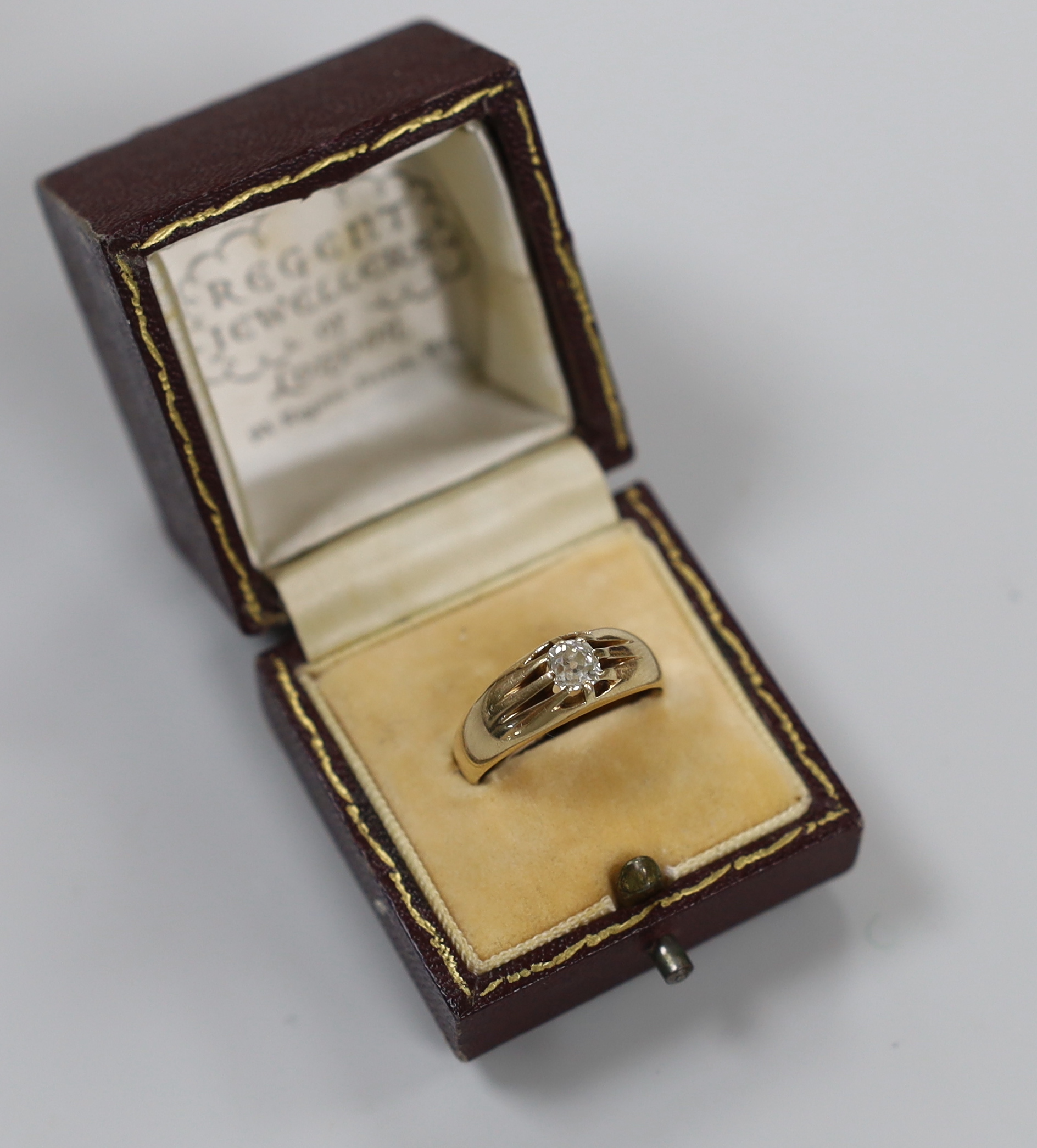A late Victorian 15ct gold and claw set solitaire diamond ring, size Q, gross weight 5.5 grams.